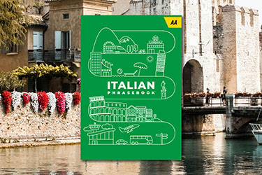 AA Italian Phrasebook against a background image of a castle in Sirmione, Italy.