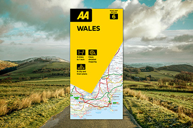 AA Road Map Wales against a background image of country roads.