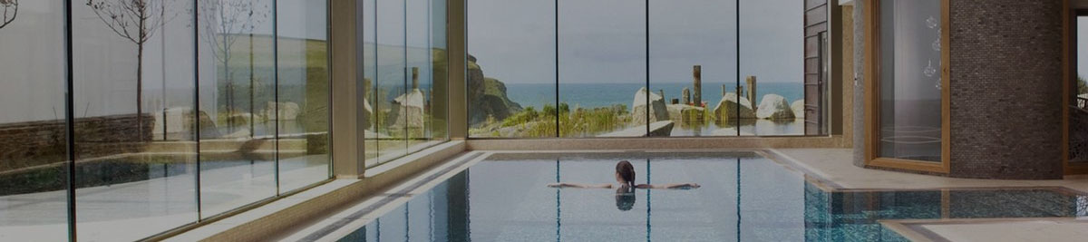 Woman swimming in an indoor pool.